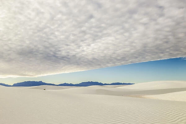 USA, New Mexico, White Sands National Park. Sand dunes and thick cloud cover. Credit as