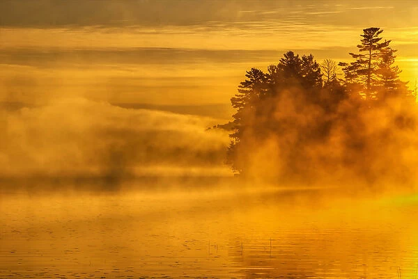 USA, New York, Adirondack Mountains. Morning mist on Raquette Lake