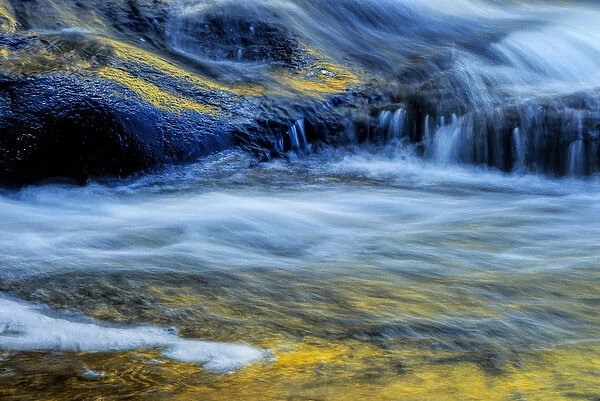 USA, New York, Adirondack Mountains. Flowing stream at Buttermilk Falls. Credit as