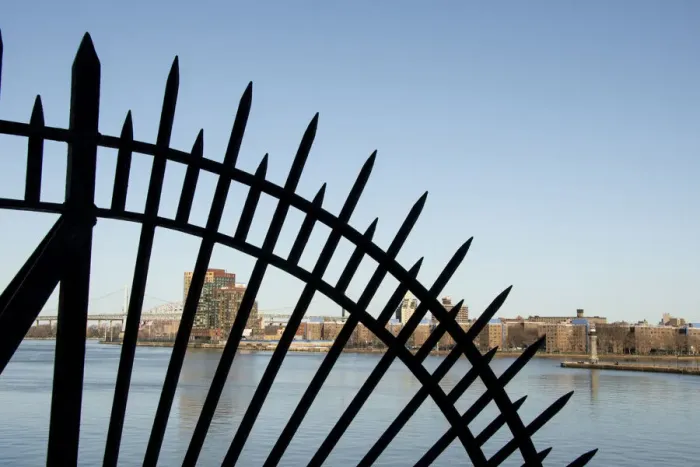 Framed Print : USA, New York City, Manhattan, Upper East Side. John Finley Walk along East River, iron grating in front of river
