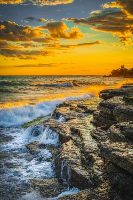 Framed Print : USA, New York, Lake Ontario. Sunset waves on rocky shoreline