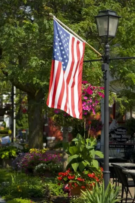 Framed Print : USA, New York, Lewiston. American flag attached to lamp post near wine shopFred J Framed Print : USA, New York, Lewiston. American flag attached to lamp post near wine shopFred J