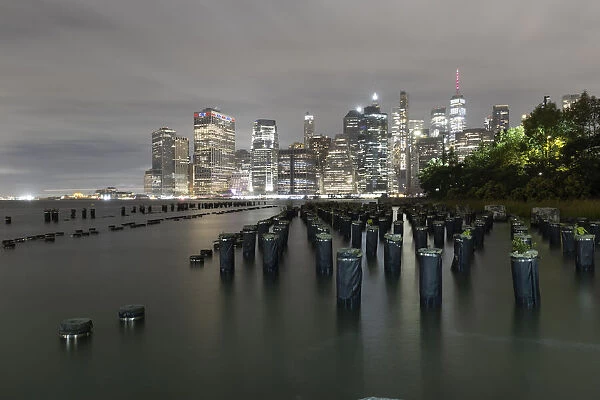 USA, New York. New York City, downtown view from Pier 1, wooden pilings in front of river in Brooklyn Heights