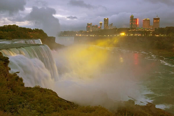 USA, New York, Niagara Falls. Twilight view of American Falls in foreground, Goat Island