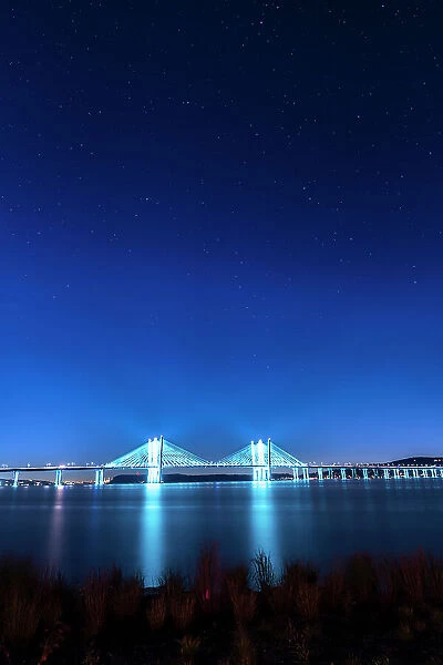 USA, New York, Tarrytown. Stars over the Hudson River and the Gov. Mario Cuomo (Tappan Zee) Bridge