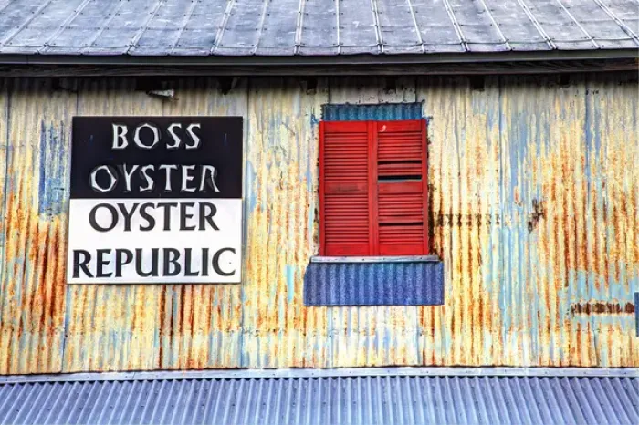 Framed Print : USA; North America; Florida; Apalachicola; Old tin building with red shutters Framed Print : USA; North America; Florida; Apalachicola; Old tin building with red shutters