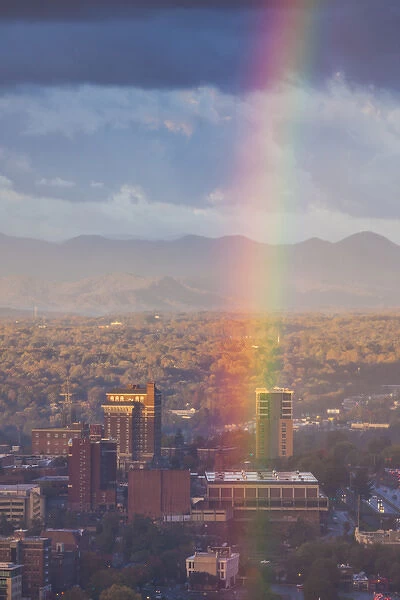 USA, North Carolina, Asheville, elevated city skyline with rainbows, dawn