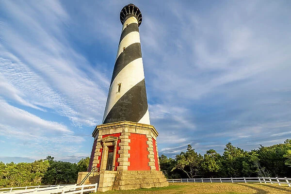 USA, North Carolina, Buxton. Cape Hatteras Lighthouse in late afternoon sun