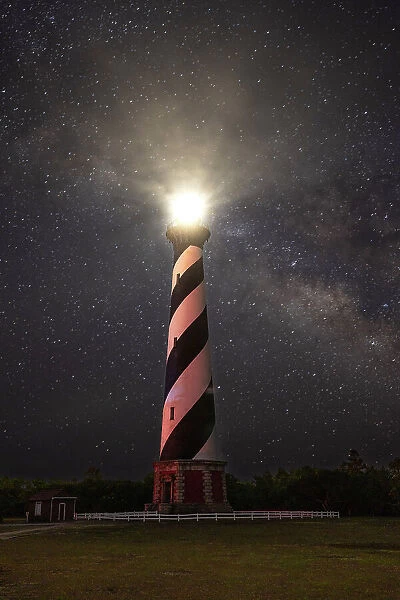 USA, North Carolina, Buxton. Cape Hatteras Lighthouse and the Galactic Core of the Milky Way