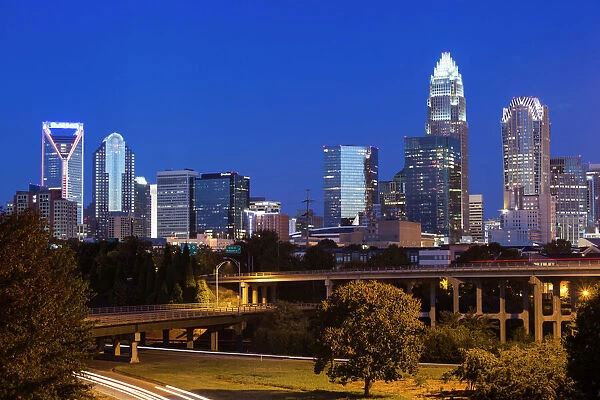 USA, North Carolina, Charlotte, elevated view of the city skyline from Route 74, dawn