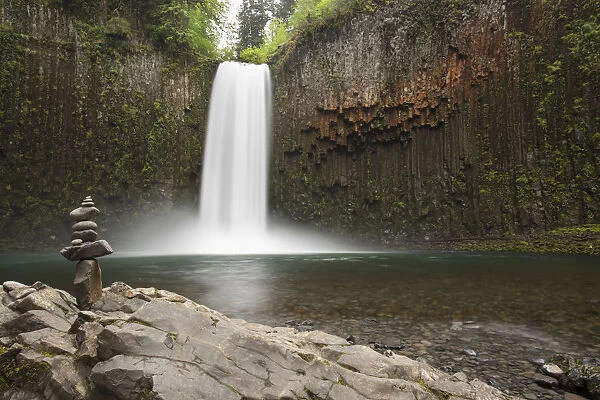 USA, Oregon. Abiqua Falls and stacked pile of rocks