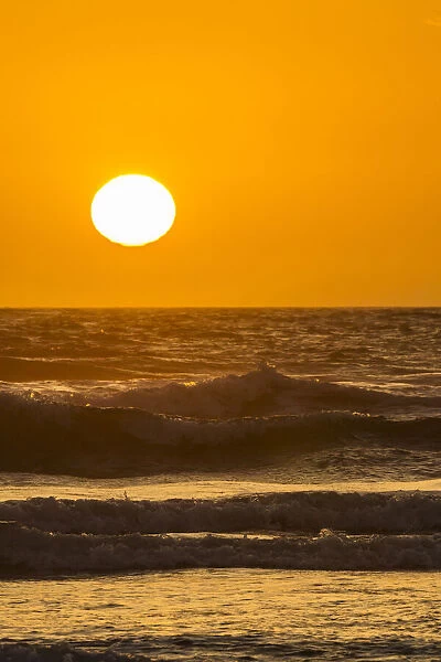 USA, Oregon, Bandon Beach. Sunset on ocean surf. Credit as