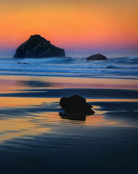 USA, Oregon, Bandon. Face Rock sea stack at sunset. Credit as