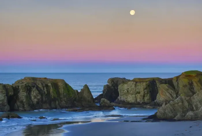 Framed Print : USA, Oregon, Bandon. Full moon sets over sea stacks on beach Framed Print : USA, Oregon, Bandon. Full moon sets over sea stacks on beach