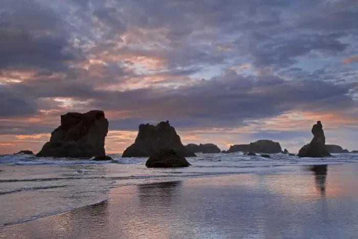 Framed Print : USA, Oregon, Bandon. Sunset colors clouds and silhouettes seastacks on ocean beach