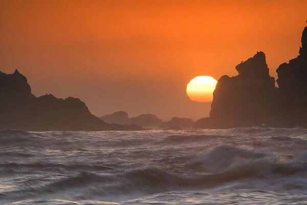 USA, Oregon, Bandon. Sunset on sea stacks and ocean