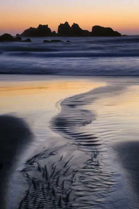 Framed Print : USA, Oregon, Bandon. Water flows into ocean at low tide on Bandon Beach. Credit as Framed Print : USA, Oregon, Bandon. Water flows into ocean at low tide on Bandon Beach. Credit as