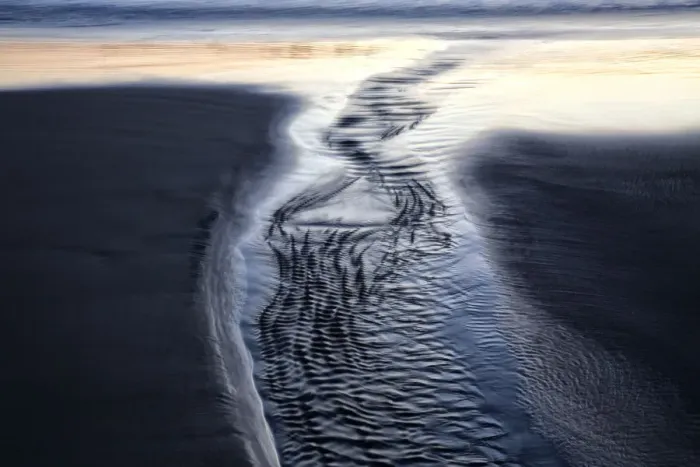 Framed Print : USA, Oregon, Bandon. Water flows into ocean at low tide on Bandon Beach. Credit as Framed Print : USA, Oregon, Bandon. Water flows into ocean at low tide on Bandon Beach. Credit as