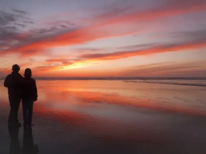 Framed Print : USA, Oregon, Cannon Beach. Couple contemplates the sunset Framed Print : USA, Oregon, Cannon Beach. Couple contemplates the sunset