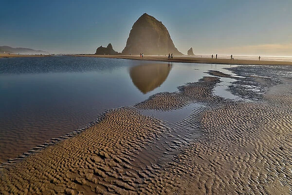 USA, Oregon. Cannon Beach with Haystack near sunset and low tide