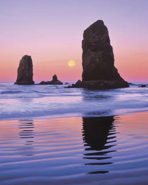 Framed Print : USA, Oregon, Cannon Beach. The Needles rock monoliths at sunrise showing moon at moonset Framed Print : USA, Oregon, Cannon Beach. The Needles rock monoliths at sunrise showing moon at moonset