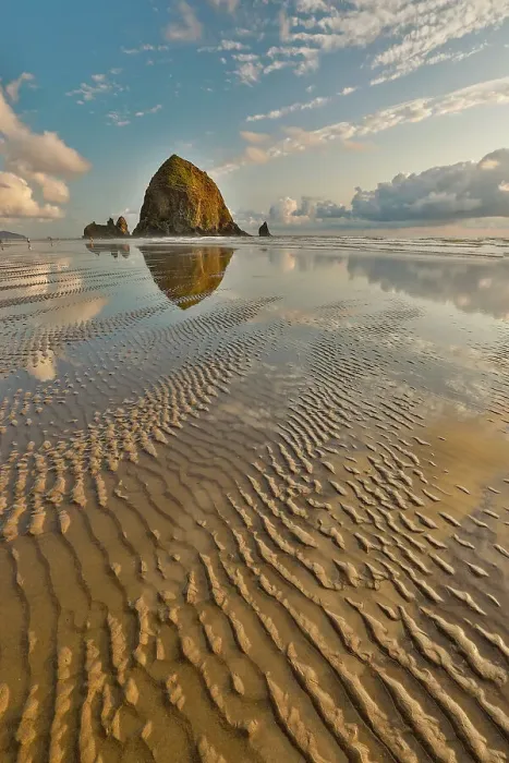 Framed Print : USA, Oregon, Cannon Beach. Sunset golden colors with ripples in sandy beach and The Haystack Rock