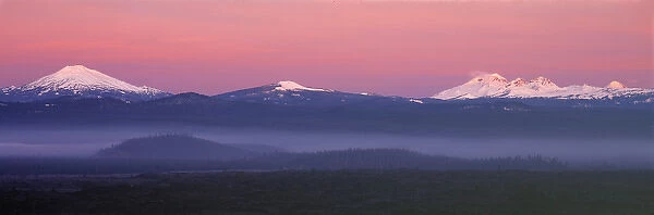 USA, Oregon, Cascades Range. The pink blanket of sunrise warms the Oregon Cascades