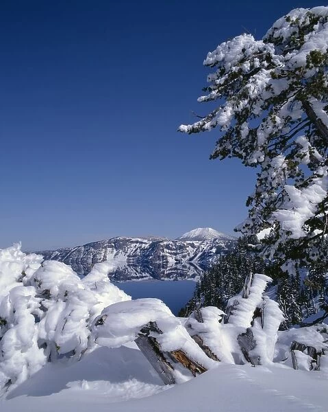 USA, Oregon, Crater Lake National Park. Winter snow accumulates at Crater Lake