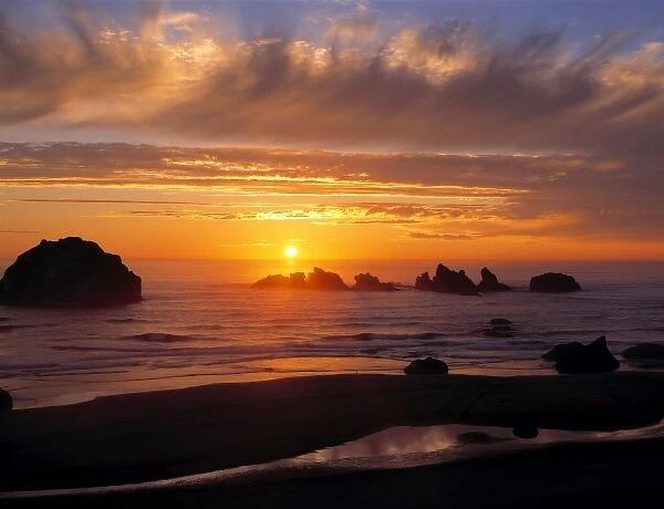 USA, Oregon, Face Rock Wayside. A wildly-colored sunset graces the sky at Face Rock