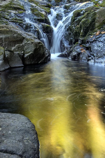 USA, Oregon, Florence. Waterfall in stream