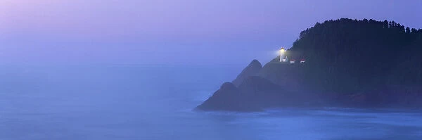 USA, Oregon, Heceta Head. The beacon of Heceta Head Lighthouse shines through the