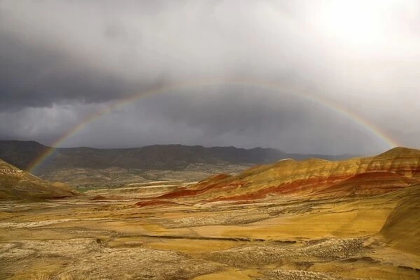 USA, Oregon, John Day Fossil Beds National Monument. Scenic of rainbow over the Painted Hills