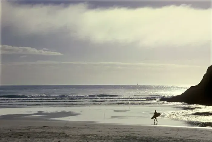 Framed Print : USA, Oregon, near Heceta Head, lone surfer going out into the Pacific Ocean