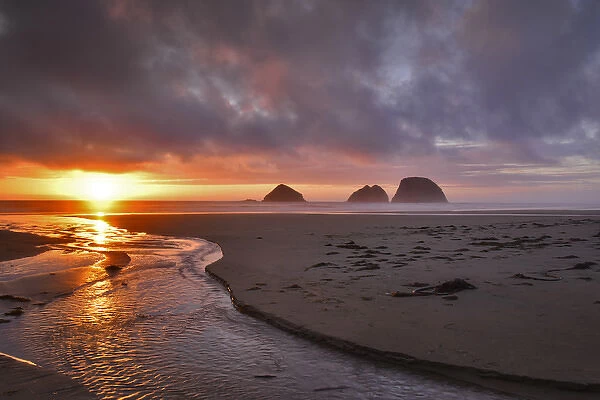 USA, Oregon, Oceanside. Sunset on Three Arch Rocks