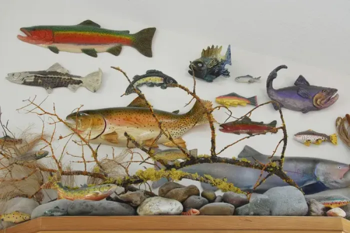 Framed Print : USA, Oregon, Portland. Eclectic collection of ceramic and wooden fish displayed on wall of home