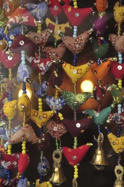 USA, Oregon, Portland. Fabric mobiles with brass bells imported from India at gift shop