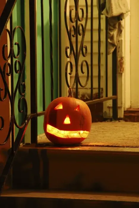 Framed Print : USA, Oregon, Portland. Lighted jack-o-lantern on front porch awaiting trick or treaters Framed Print : USA, Oregon, Portland. Lighted jack-o-lantern on front porch awaiting trick or treaters