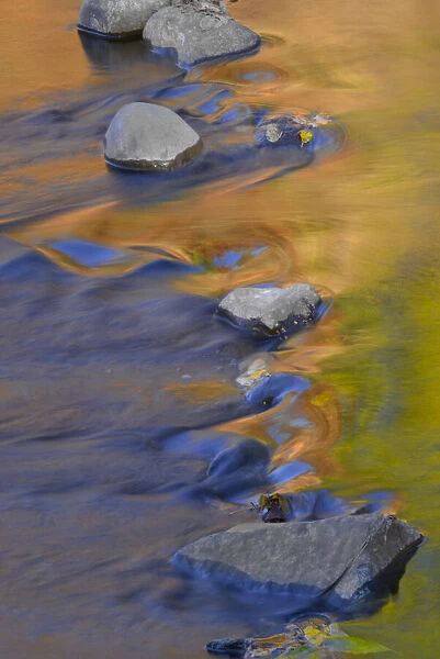 USA, Oregon. Rocks and reflections in Butte Creek