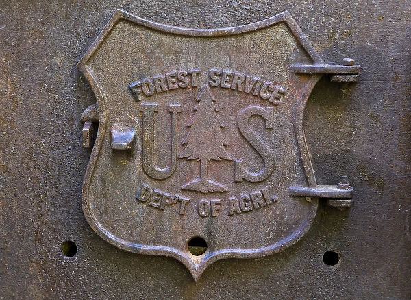 USA, Oregon, Rogue River National Forest. Close-up of US Forest Service plaque on fireplace door