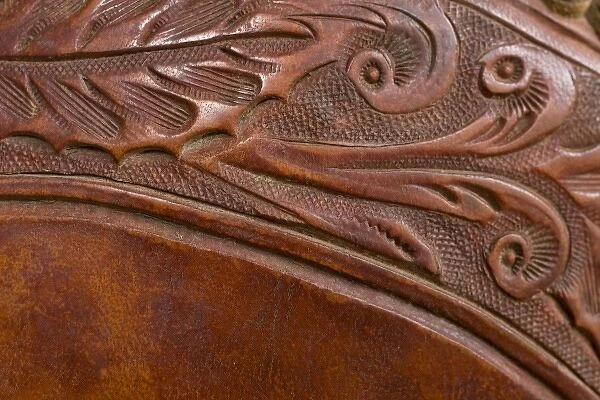 USA, Oregon, Seneca, Ponderosa Ranch. Tooled leather details on a saddle
