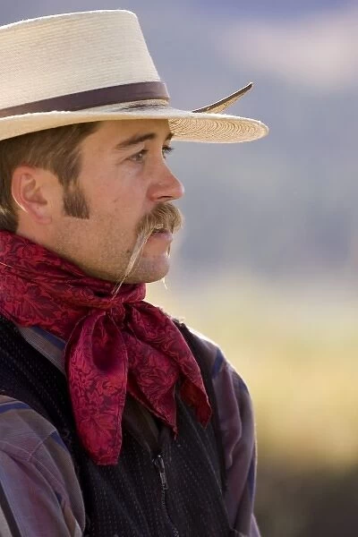 USA, Oregon, Seneca, Ponderosa Ranch. Portrait of a cowboy with a bandana and handlebar mustache