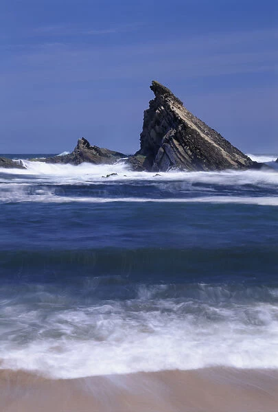 USA, Oregon, Shore Acres State Park. Incoming surf and tilted, sandstone sea stack