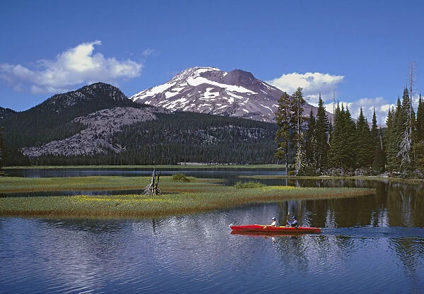 USA, Oregon, Sparks Lake. Kayakers enjoy a summer day on Sparks Lake in central Oregon