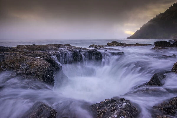 USA, Oregon. Thors Well and ocean at sunset