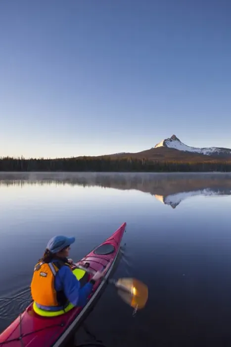 Framed Print : USA, Oregon. A woman in a sea kayak paddles at dawn on Big Lake, Oregon, in the Oregon Cascades Framed Print : USA, Oregon. A woman in a sea kayak paddles at dawn on Big Lake, Oregon, in the Oregon Cascades