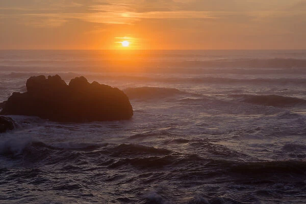 USA, Oregon, Yachats, Sunset over basalt sea stacks