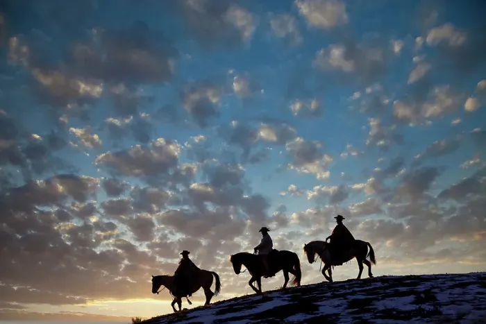 Framed Print : USA, Shell, Wyoming. Hideout Ranch cowboys and cowgirls silhouetted against sunset riding on ridgeline. (PR, MR) Framed Print : USA, Shell, Wyoming. Hideout Ranch cowboys and cowgirls silhouetted against sunset riding on ridgeline. (PR, MR)