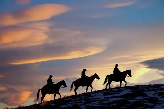 Framed Print : USA, Shell, Wyoming. Hideout Ranch cowboys and cowgirls silhouetted against sunset riding on ridgeline. (PR, MR) Framed Print : USA, Shell, Wyoming. Hideout Ranch cowboys and cowgirls silhouetted against sunset riding on ridgeline. (PR, MR)