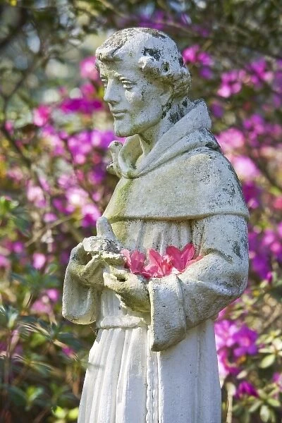 USA, South Carolina, Charleston. Garden Statue and Blooming Azaleas at Magnolia Plantation