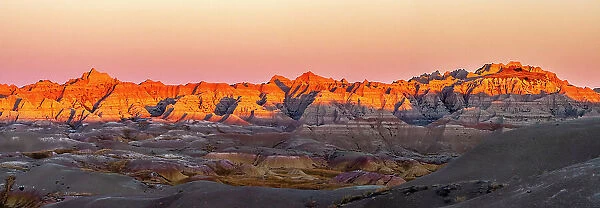 USA, South Dakota, Badlands National Park. Panoramic of sunrise on arid park formations